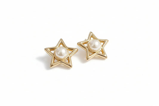 Gold star-shaped earrings with pearl centers 